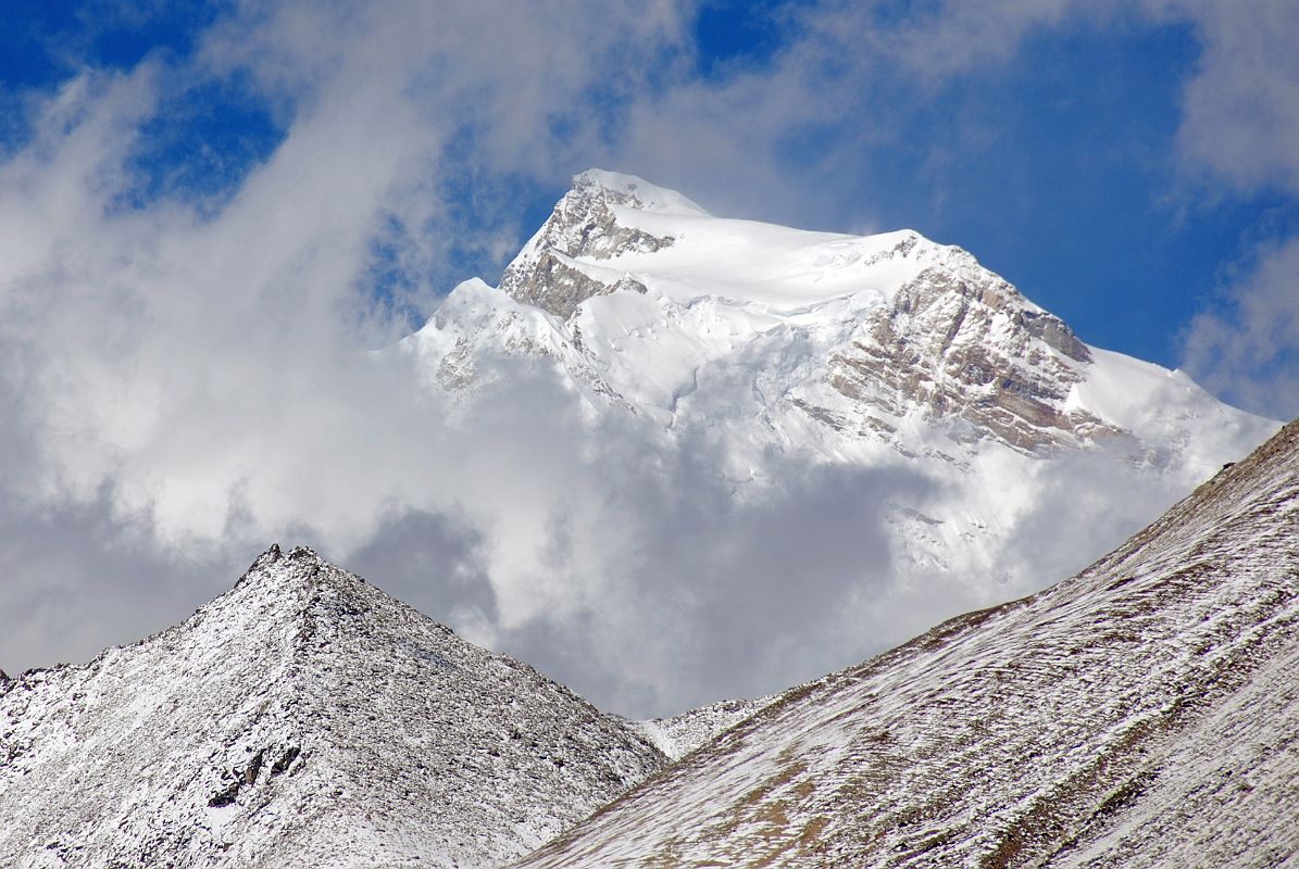 03 Shishapangma And Pungpa Ri From Ridge Above Nyalam On Trek To Taro Tso After cresting the ridge above Nyalam, Shishapangma came out of the clouds for a few minutes. The peak just below and left of the summit is Pungpa Ri (7445m).